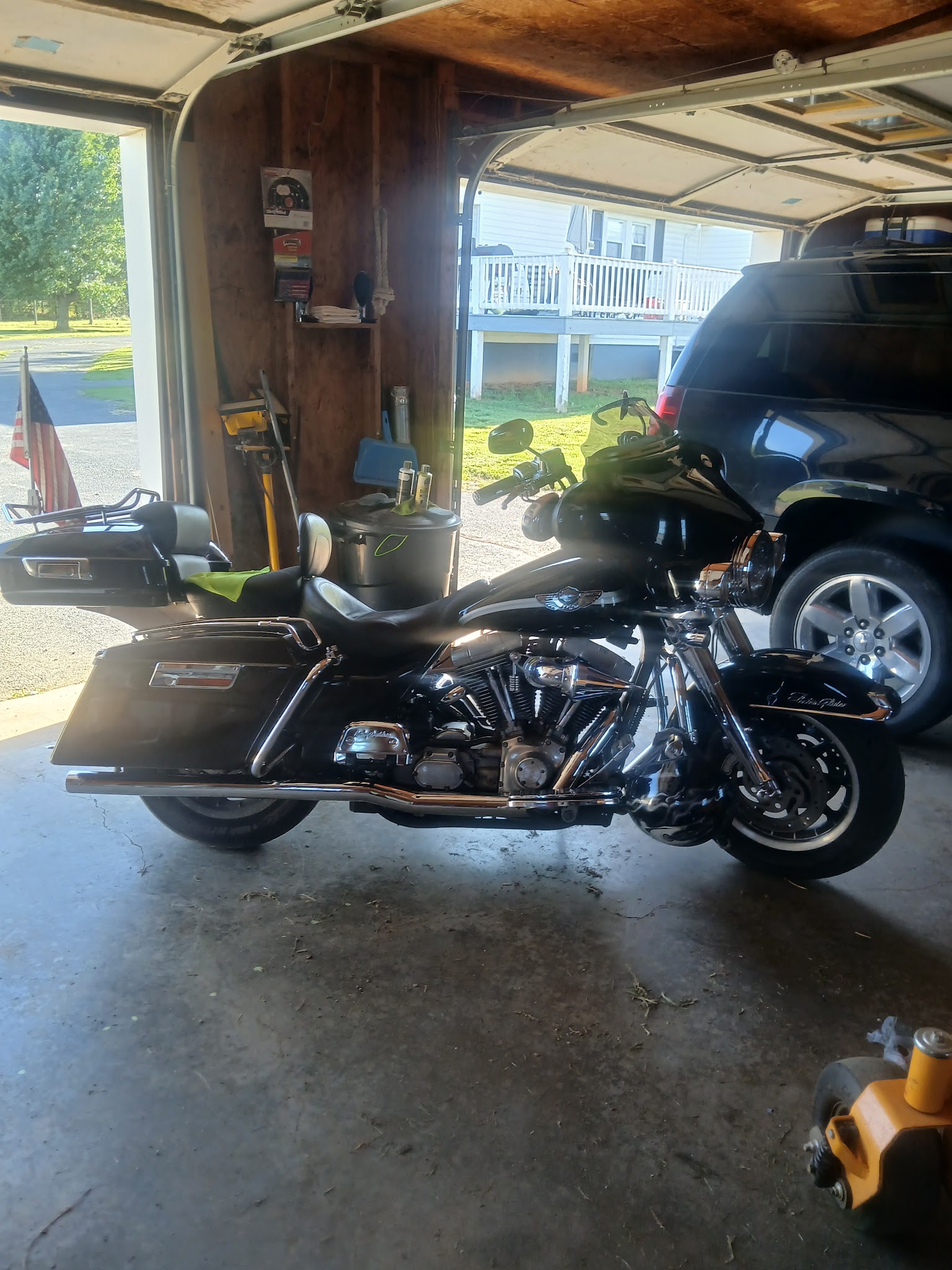 Black Harley-Davidson Electra Glide touring motorcycle in the garage