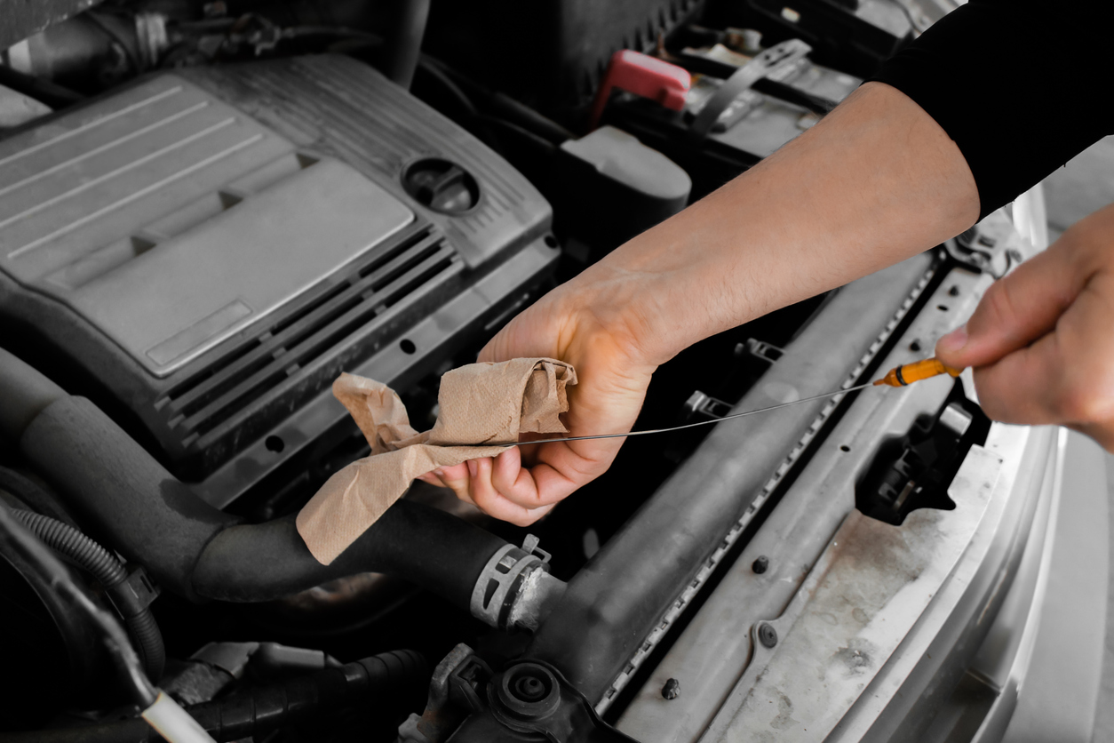 Fresh oil being poured into an engine during a maintenance service